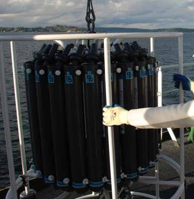 Scientists aboard NOAA Ship Okeanos Explorer bring the deployable CTD rosette back on board after sending it to the seafloor. A CTD probe attached to the rosette collects continuous conductivity, temperature and depth information throughout the water column while deployed. Additionally, the Niskin bottles attached to the rosette can be triggered to collect water samples at specific depths.