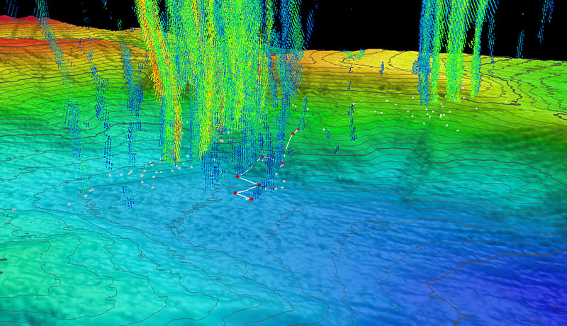 Three-dimensional perspective of a ROV Deep Discoverer dive track (white lines) and waypoints (red points) with superposed water column bubble plumes (multi-colored point clouds) imaged by NOAA Ship Okeanos Explorer during a previous mission. Methane bubble plumes at Norfolk Seeps have been imaged rising over 900 meters (2,950 feet) above the seafloor in previous surveys. Bathymetric data were collected with the Okeanos Explorer multibeam sonar and are contoured at 10-meter (about 33-foot) intervals. The locations of previously identified seeps are indicated with white points. All data shown at two times vertical exaggeration.