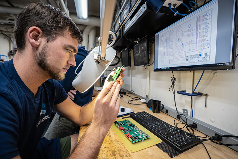 When the remotely operated vehicles (ROV) can’t be deployed, our engineers ensure these vital exploration tools are in tip-top shape and ready for the next dive. Here, Levi Unema, electrical engineer, examines electronics that support ROV operations. One missed connection could mean a valuable piece of data lost miles below the surface.