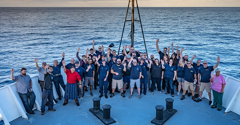 The mission team and crew gathered for a group photo during the 2019 Southeastern U.S. Deep-sea Exploration. Image courtesy of Art Howard, Global Foundation for Ocean Exploration, NOAA Office of Ocean Exploration and Research, 2019 Southeastern U.S. Deep-sea Exploration.