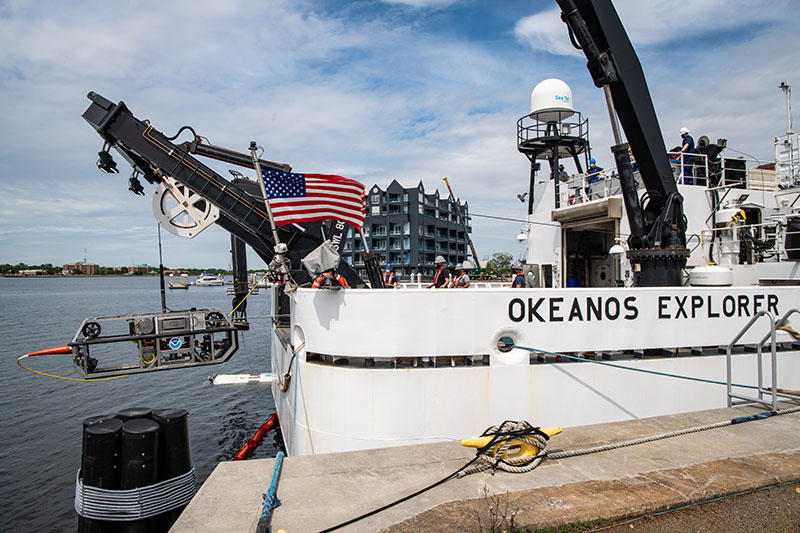 To assess operational readiness, the remotely operated vehicles (ROVs) undergo dunk tests. Here, ROV Seirios gets dunked while still in port during the 2021 ROV Shakedown.