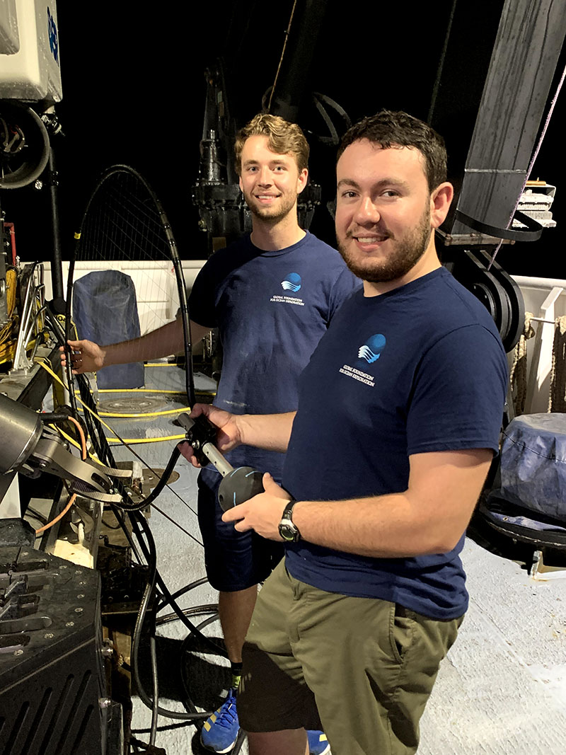 NOAA Ship Okeanos Explorer is an excellent platform for providing the next generation of ocean explorers the opportunity to learn more about ocean exploration and put their skills and knowledge to the test. Here, engineering interns Jonathan Allen (left) and Evan Spalding (right) with the Global Foundation for Ocean Exploration pose with a “bioluminescence agitator” that they built to deploy on remotely operated vehicle Deep Discoverer for the purpose of encouraging deep-sea animals to show us their bioluminescence.
