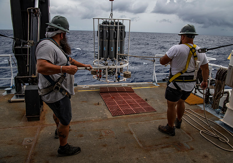 Peter Brill and Chris Remaley prepare to launch the CTD during the 2022 Caribbean Mapping expedition. CTD stands for conductivity, temperature, and depth, and refers to a package of electronic devices used to detect how the conductivity and temperature of water changes relative to depth. The CTD is an essential tool used in all disciplines of oceanography, providing important information about physical, chemical, and even biological properties of the water column.