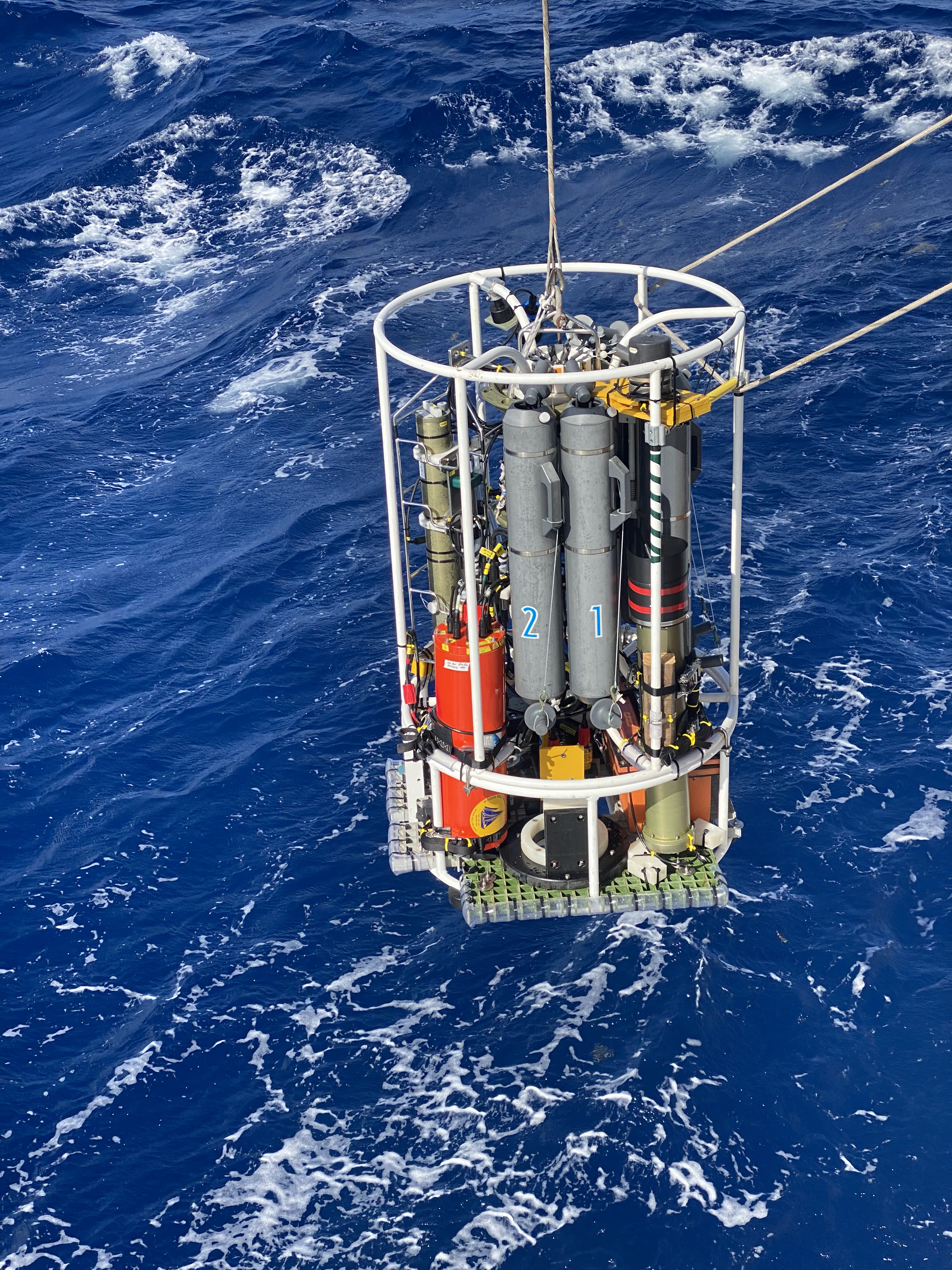 The conductivity, temperature, and depth (CTD) rosette is lowered into the ocean for the second deep-sea camera engineering test of the 2022 Puerto Rico Mapping and Deep-Sea Camera Demonstration.