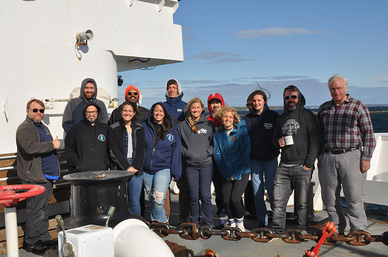 The team gathers on the deck of NOAA Ship Okeanos Explorer after the successful completion of the 2022 Puerto Rico Mapping and Deep-Sea Camera demonstration.