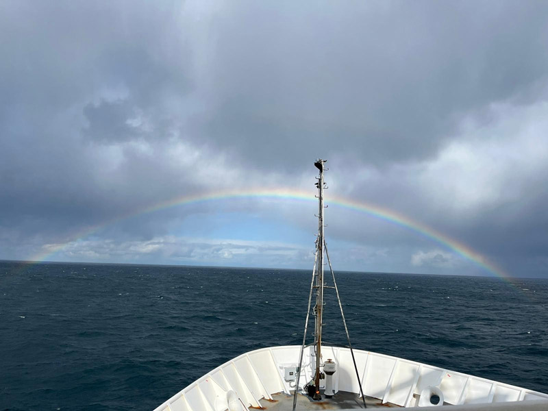 In Fall 2022, NOAA Ocean Exploration conducted an exploratory expedition in unexplored regions off the coasts of California and Oregon in support of the EXpanding Pacific Research and Exploration of Submerged Systems (EXPRESS) campaign. In this image, NOAA Ship Okeanos Explorer transits through a rainbow on the last day of the expedition and the last day of the 2022 field season out in the Pacific Ocean. Image courtesy of NOAA Ocean Exploration, EXPRESS: West Coast Mapping 2022.