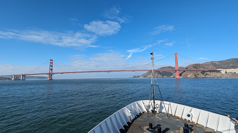 NOAA Ship Okeanos Explorer approaching the Golden Gate Bridge after leaving port for the 2023 EXPRESS: Exploration of Central California Coast expedition.