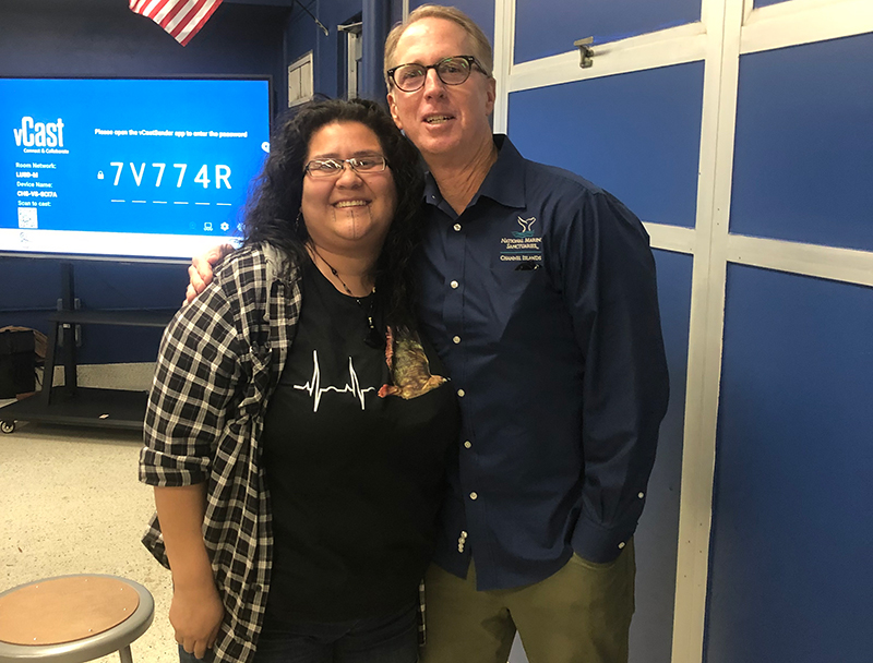 Mia Lopez’s daughter Lacee and Michael Murray, deputy sanctuary superintendent at Channel Islands National Marine Sanctuary, during the Connect With the Deep Ocean community event at the Cabrillo High School Aquarium.