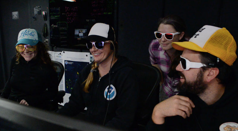 Amanda Bittinger, Meme Lobecker, Kelly Suhre, and Charlie Wilkins in the mission control room on NOAA Ship Okeanos Explorer.