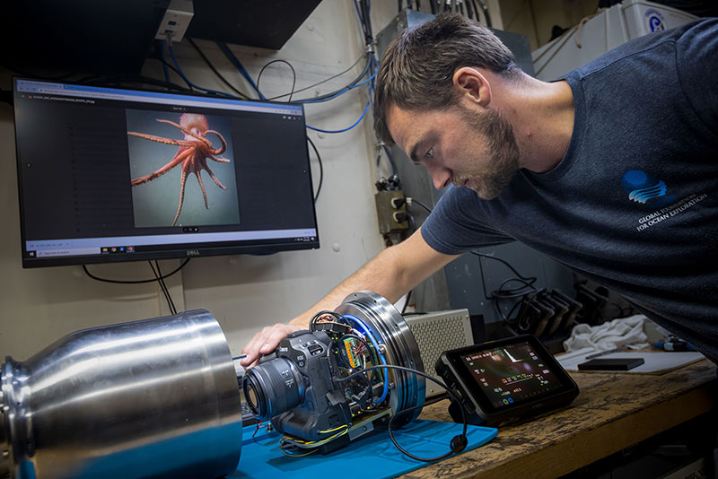Global Foundation for Ocean Exploration electrical engineer Levi Unema works on the still camera recently installed on remotely operated vehicle Deep Discoverer.