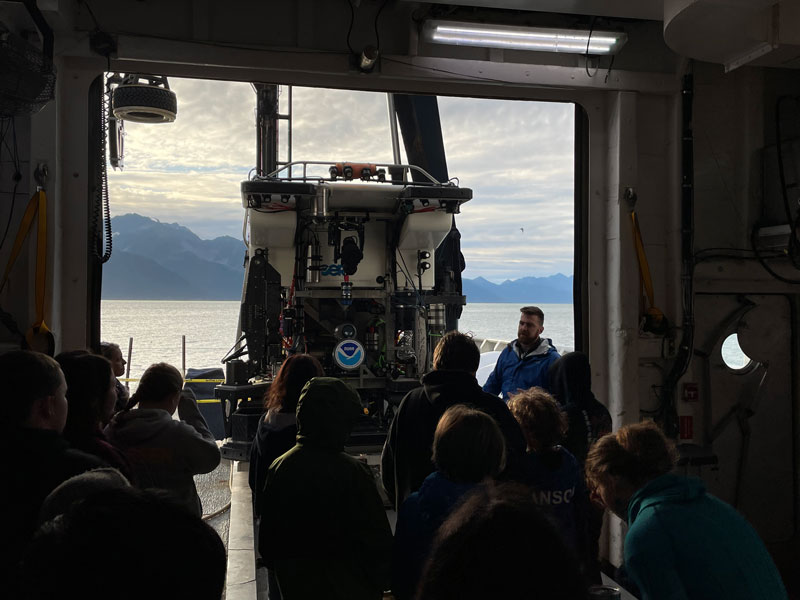 Lars Murphy, of the Global Foundation for Ocean Exploration, explains the intricacies of remotely operated vehicle Deep Discoverer to local students in Seward, Alaska.