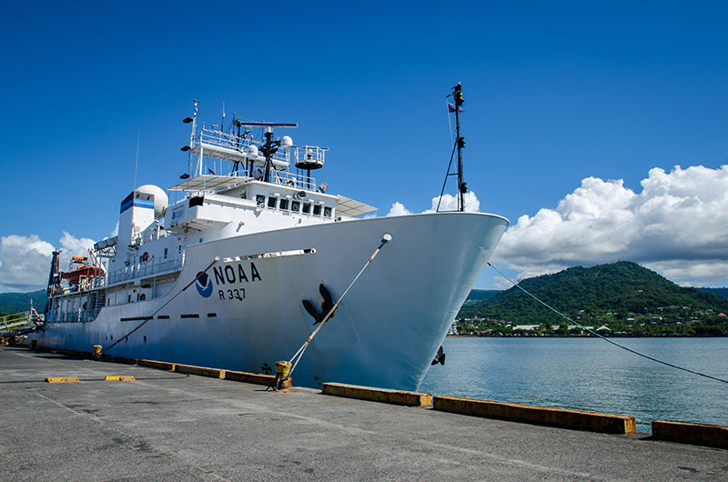 NOAA Ship Okeanos Explorer docked at the pier at the Port of Apia in Samoa prior to the start of the the Discovering the Deep: Exploring Remote Pacific Marine Protected Areas expedition.