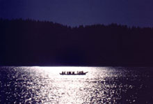 image of canoes in the sunset