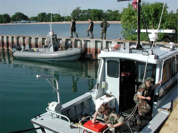 EOD MU 10, prepare their boats and equipment for another day of survey.