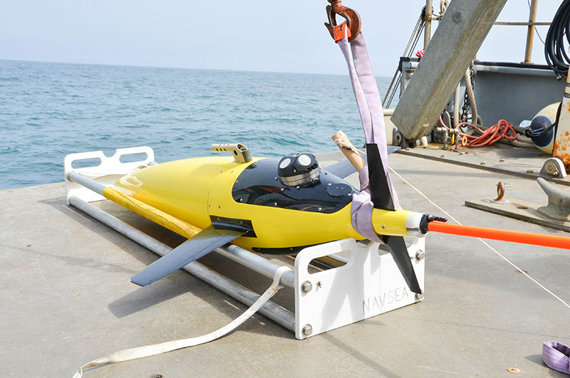 Seaglider, an autonomous underwater vehicle, is outfitted with an acoustic Doppler current profiler (ADCP) and prepared for deployment. This underwater robot will simultaneously sample the physical and biological properties of the waters where mid-trophic organisms reside.