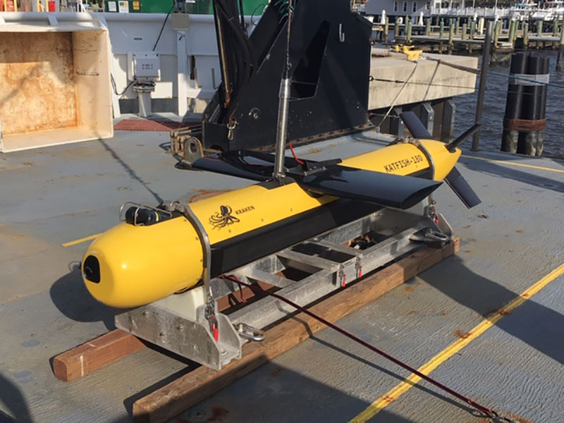 Photo of the KATFISH on deck. The fins allow for operator adjustments (side-to-side and up-down) along track during a survey.