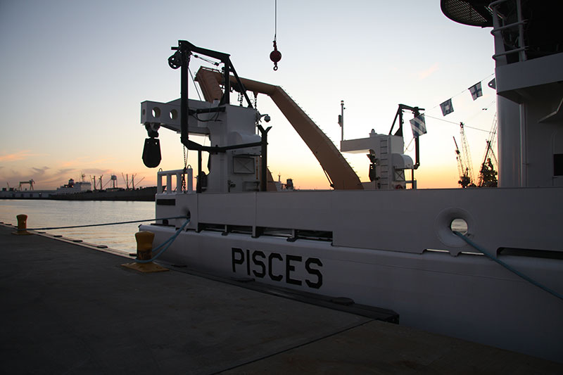 NOAA Ship Pisces alongside the dock in Pascagoula, Mississippi, at sunset. Image courtesy of David Hall/NOAA.